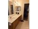 Bathroom features a double sink vanity and ample lighting at 7857 Petrea Ln, Charlotte, NC 28227