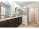 Elegant bathroom featuring a double sink vanity and a glass door shower at 8524 Loxton Cir, Charlotte, NC 28214