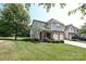 Charming two-story townhome with well-maintained lawn and landscaping at 8524 Loxton Cir, Charlotte, NC 28214