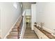 Bright foyer showcasing hardwood floors, a staircase, and elegant console table with decorations at 8524 Loxton Cir, Charlotte, NC 28214