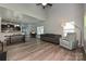Open living area featuring hardwood floors, comfortable seating, and a seamless flow to the kitchen at 8524 Loxton Cir, Charlotte, NC 28214