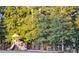 Community playground with swings, slides, and lush green trees offering a fun and safe environment at 8524 Loxton Cir, Charlotte, NC 28214