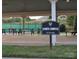 Sports complex featuring picnic tables, a sign, and tennis court in the background at 8524 Loxton Cir, Charlotte, NC 28214
