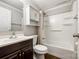 Standard bathroom with a shower-tub combination, cabinet, and vanity sink at 903 Rhode Island Ave, Kannapolis, NC 28083