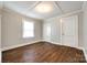 Comfortable bedroom with hardwood floors, neutral walls, and a window for natural light at 903 Rhode Island Ave, Kannapolis, NC 28083