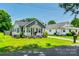 Charming home with beautiful landscaping and a welcoming front porch area at 903 Rhode Island Ave, Kannapolis, NC 28083