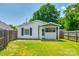 Charming home with a welcoming front porch, neat lawn, and classic black shutters at 903 Rhode Island Ave, Kannapolis, NC 28083
