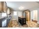 Bright kitchen featuring wood cabinets, stainless appliances, and portable island, with easy access to other rooms at 903 Rhode Island Ave, Kannapolis, NC 28083