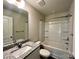 Bright bathroom featuring granite counters, modern fixtures, and a shower-tub combo at 907 W Georgia Ave, Bessemer City, NC 28016