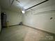 Spacious garage, perfect for parking and storage needs, featuring a concrete floor and ample lighting at 907 W Georgia Ave, Bessemer City, NC 28016