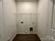 A convenient laundry area offering plenty of space for a washer, dryer, and storage at 907 W Georgia Ave, Bessemer City, NC 28016