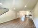 Spacious living room featuring hardwood floors, neutral walls, and ample natural light at 907 W Georgia Ave, Bessemer City, NC 28016