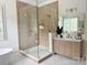 Bright bathroom with glass shower, free-standing tub, and vanity; a spa-like retreat at 9604 Oliver Ct, Harrisburg, NC 28075