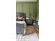 Stylish bedroom featuring olive green walls, wood accents, and a comfortable bed, creating a relaxing and inviting retreat at 9604 Oliver Ct, Harrisburg, NC 28075