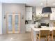 Well-lit kitchen featuring an island with seating, pendant lights, and stylish design at 9604 Oliver Ct, Harrisburg, NC 28075