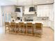 Large kitchen island with seating, modern pendant lights, and plenty of cabinet space at 9604 Oliver Ct, Harrisburg, NC 28075