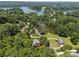 Aerial view of a lakeside community nestled among dense trees showcases natural beauty and serenity at 1019 Westlake Dr, Kannapolis, NC 28081