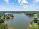 Scenic aerial view of a lake surrounded by lush greenery and beautiful waterfront properties at 1019 Westlake Dr, Kannapolis, NC 28081