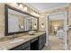 Spacious bathroom with double vanity, decorative mirrors, and wallpapered walls at 1019 Westlake Dr, Kannapolis, NC 28081