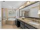 Luxurious bathroom with soaking tub, granite countertops, and a separate glass shower at 1019 Westlake Dr, Kannapolis, NC 28081