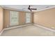 Bedroom with ceiling fan and two windows providing natural light at 1019 Westlake Dr, Kannapolis, NC 28081