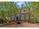 Classic brick home with elegant dormers and meticulous landscaping offers timeless curb appeal at 1019 Westlake Dr, Kannapolis, NC 28081