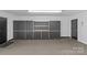 Garage with storage cabinets and workshop area at 1019 Westlake Dr, Kannapolis, NC 28081