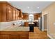 Spacious kitchen with wooden cabinets, granite countertops, a kitchen island, and stainless steel appliances at 1019 Westlake Dr, Kannapolis, NC 28081