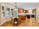 Well-lit eat-in kitchen with custom wood cabinetry, island and hardwood floors, a chef's delight at 1019 Westlake Dr, Kannapolis, NC 28081