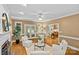 Cozy living room with a fireplace, hardwood floors, and comfortable seating arrangement perfect for relaxing at 1019 Westlake Dr, Kannapolis, NC 28081