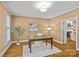 Bright home office with hardwood floors, natural light, and a view through doorway at 1019 Westlake Dr, Kannapolis, NC 28081