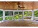 Inviting screened-in porch features brick flooring, wood ceiling, ceiling fan, and views of the lush backyard at 1019 Westlake Dr, Kannapolis, NC 28081