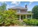 Back exterior view of a brick home with large screened-in porch and landscaped yard at 1019 Westlake Dr, Kannapolis, NC 28081