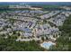 An aerial view of the neighborhood showcases mature trees and a well-maintained community at 1027 Writers Way, Cornelius, NC 28031