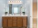 Bathroom features double sinks, wood cabinets, and ample counter space at 1027 Writers Way, Cornelius, NC 28031