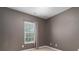 Neutral bedroom with window and modern outlets perfect for personalization at 1027 Writers Way, Cornelius, NC 28031