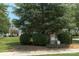 Welcome to Parsons Green, a charming community with beautifully landscaped signage and trees at 1027 Writers Way, Cornelius, NC 28031