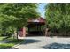 Charming covered bridge welcomes you into Antiquity, N.C. community with lush greenery and a scenic entrance at 1027 Writers Way, Cornelius, NC 28031