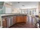 Kitchen with stainless steel dishwasher and open layout with bar seating at 1027 Writers Way, Cornelius, NC 28031