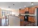 Kitchen area with granite countertops, stainless appliances, and breakfast bar at 1027 Writers Way, Cornelius, NC 28031