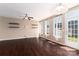Open living room with hardwood floors and large windows for abundant natural light at 1027 Writers Way, Cornelius, NC 28031
