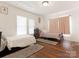 Bedroom with two beds, hardwood floors, neutral paint, and natural light at 1102 Lane St, Kannapolis, NC 28083
