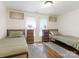 Inviting bedroom with two twin beds, hardwood floors, and bright natural light from two windows at 1102 Lane St, Kannapolis, NC 28083