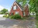 Two-story brick home with tidy landscaping and a spacious driveway at 1102 Lane St, Kannapolis, NC 28083