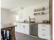 An open kitchen features white cabinets, wood countertops and stainless steel appliances at 1102 Lane St, Kannapolis, NC 28083