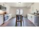 Bright kitchen featuring white cabinets, modern appliances, and a rustic-style island with seating at 1102 Lane St, Kannapolis, NC 28083