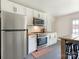 Bright kitchen with stainless steel appliances and white cabinets at 1102 Lane St, Kannapolis, NC 28083