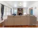 Cozy living room with hardwood floors, a fireplace, and a large sofa for relaxing at 1102 Lane St, Kannapolis, NC 28083