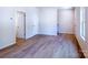 Bonus room with neutral walls, wood flooring and natural light at 11021 Warfield Ave # 03, Huntersville, NC 28078