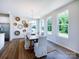 Bright dining room featuring hardwood floors, natural light and decorative wall art at 11021 Warfield Ave # 03, Huntersville, NC 28078